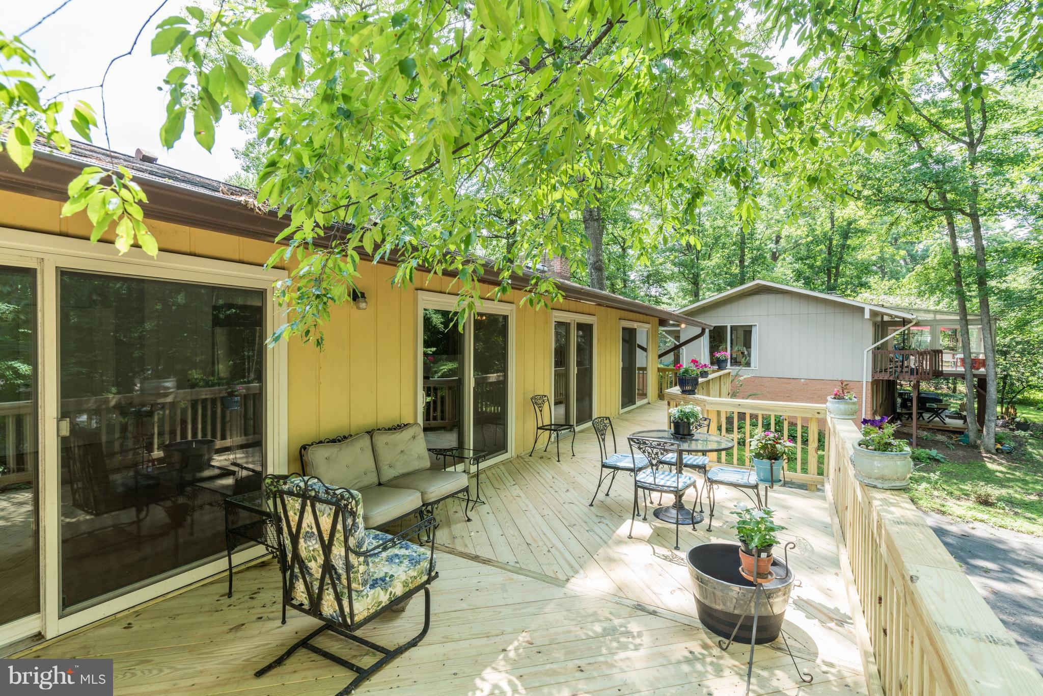 11302 Fairway Drive Reston, VA 20190 - Photo 24 of 30 a view of a patio with table and chairs and potted plants