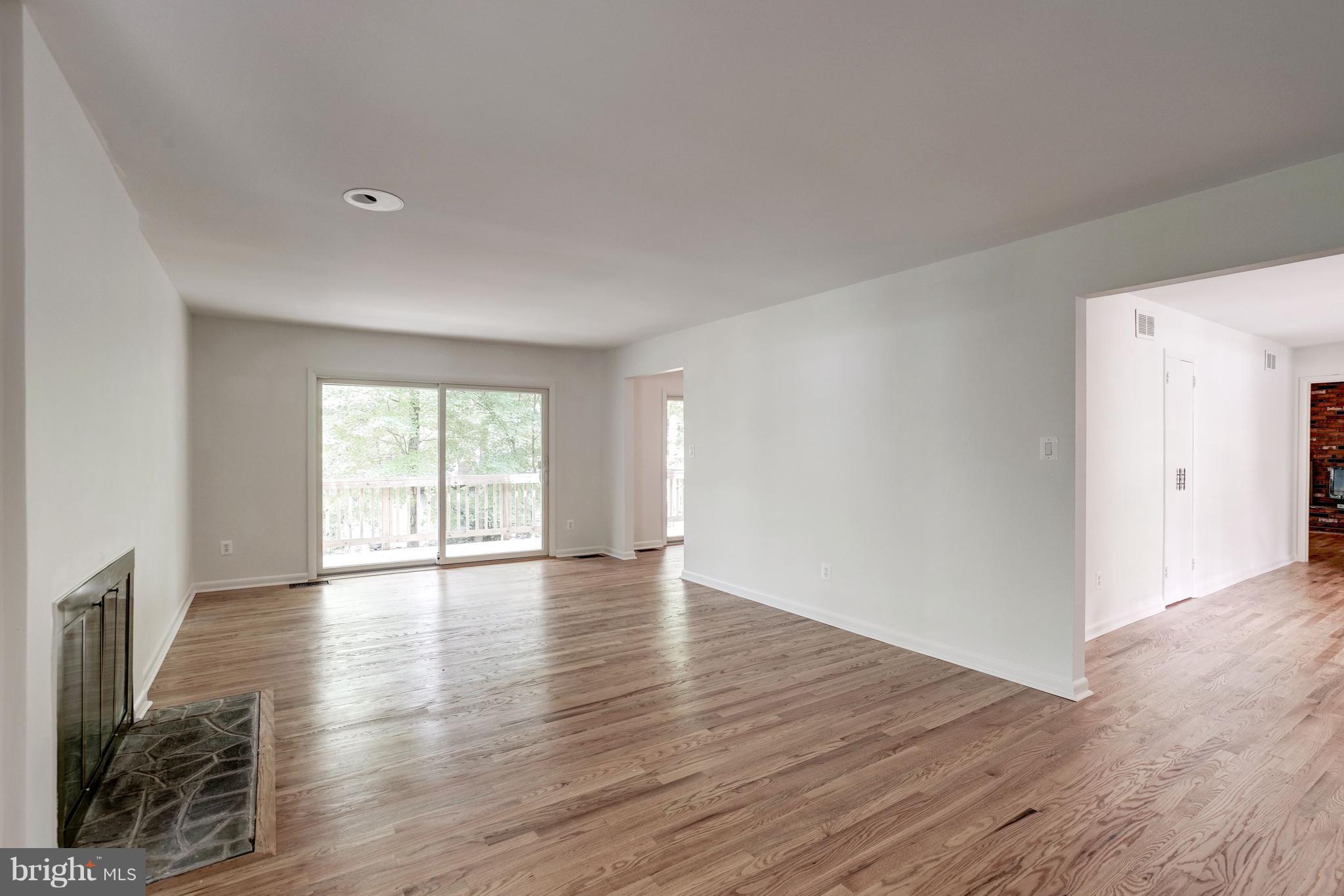 11302 Fairway Drive Reston, VA 20190 - Photo 6 of 30 a view of an empty room with wooden floor and a window
