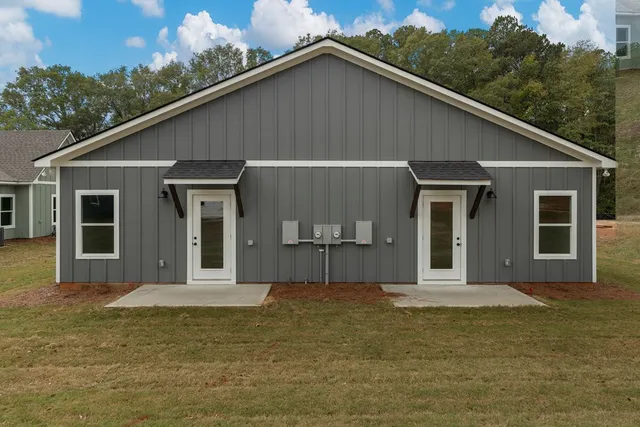 a house with trees in the background