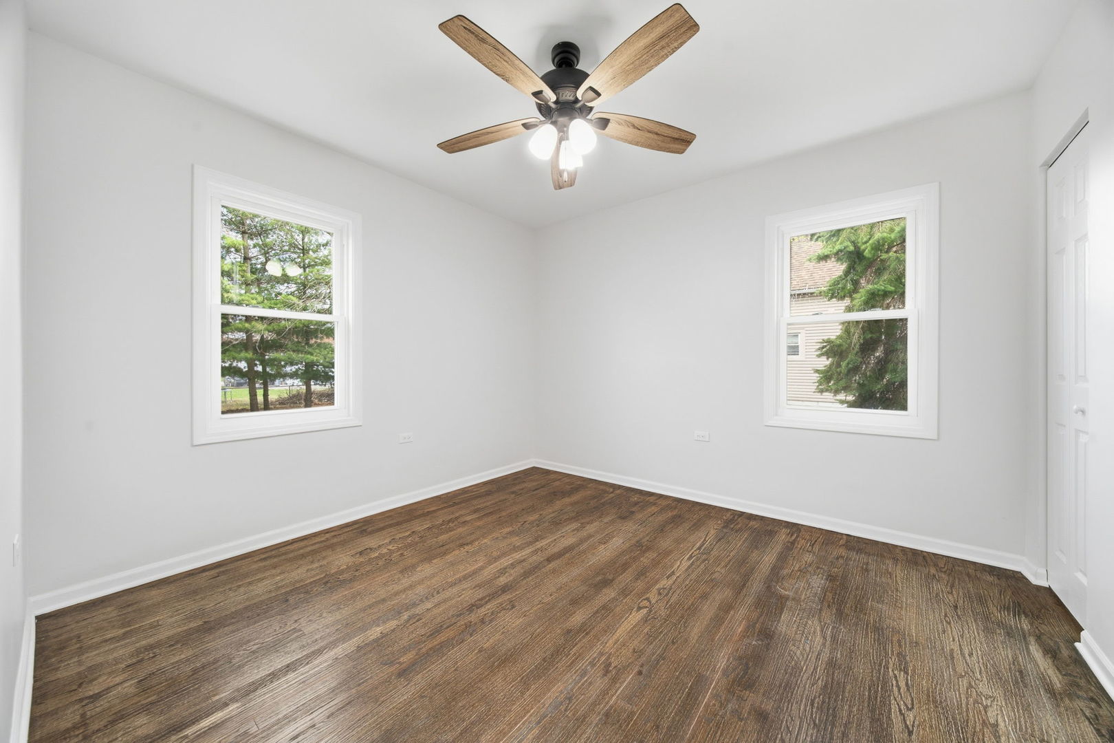 17909 Rose Street Lansing, IL 60438 - Photo 13 of 27 wooden floor in an empty room with a window