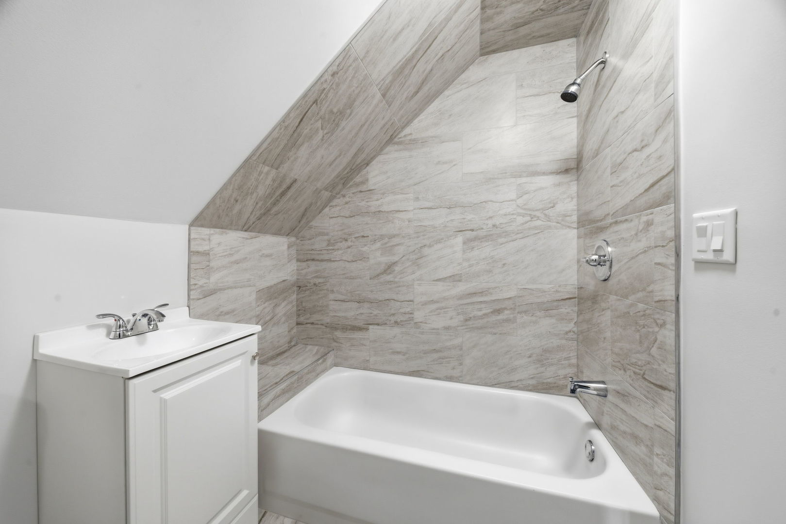 17909 Rose Street Lansing, IL 60438 - Photo 21 of 27 a bathroom with a white bath tub a sink and a shower