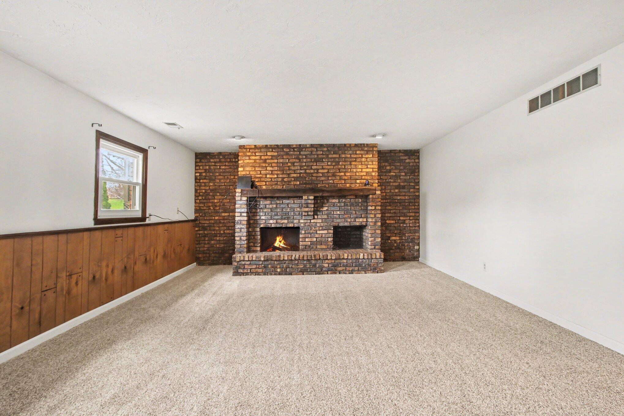 1379 Leeward Road Crown Point, IN 46307 - Photo 23 of 39 a view of empty room with a fireplace
