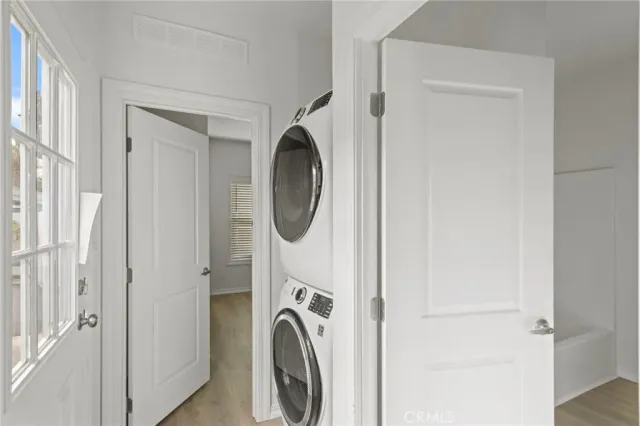 a view of a hallway with washer and dryer