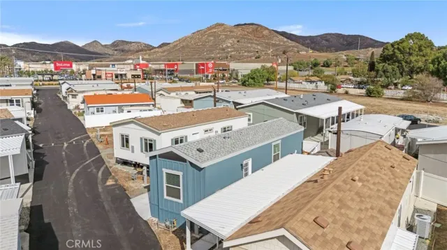 a view of a terrace with a barbeque grill and couches