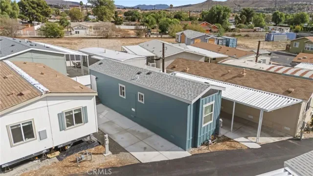 an aerial view of a residential houses with city view