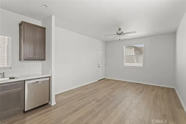 a kitchen with stainless steel appliances granite countertop a refrigerator stove and sink