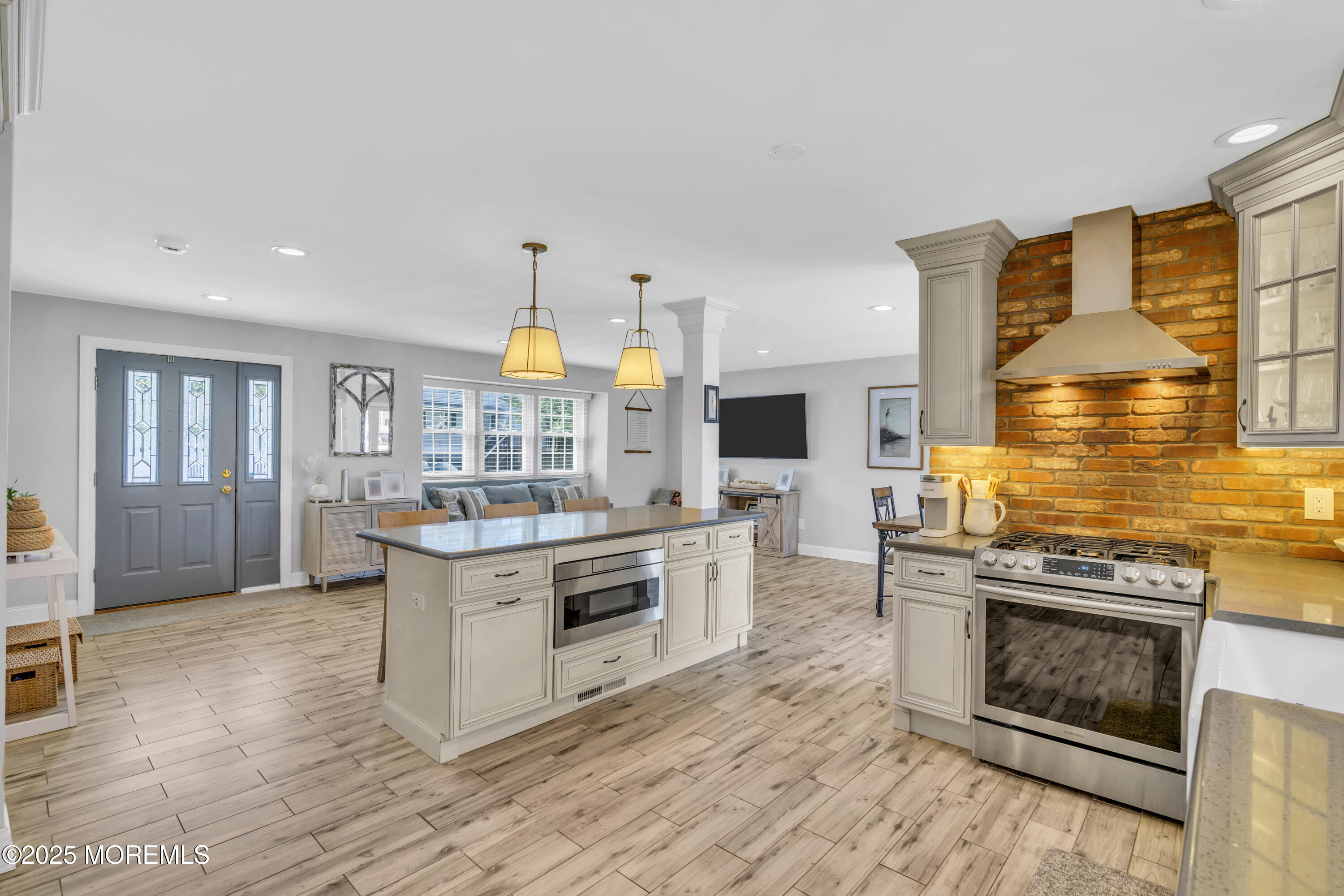 650 Drum Point Road Brick, NJ 08723 - Photo 15 of 42 a kitchen with stainless steel appliances granite countertop a stove and a sink