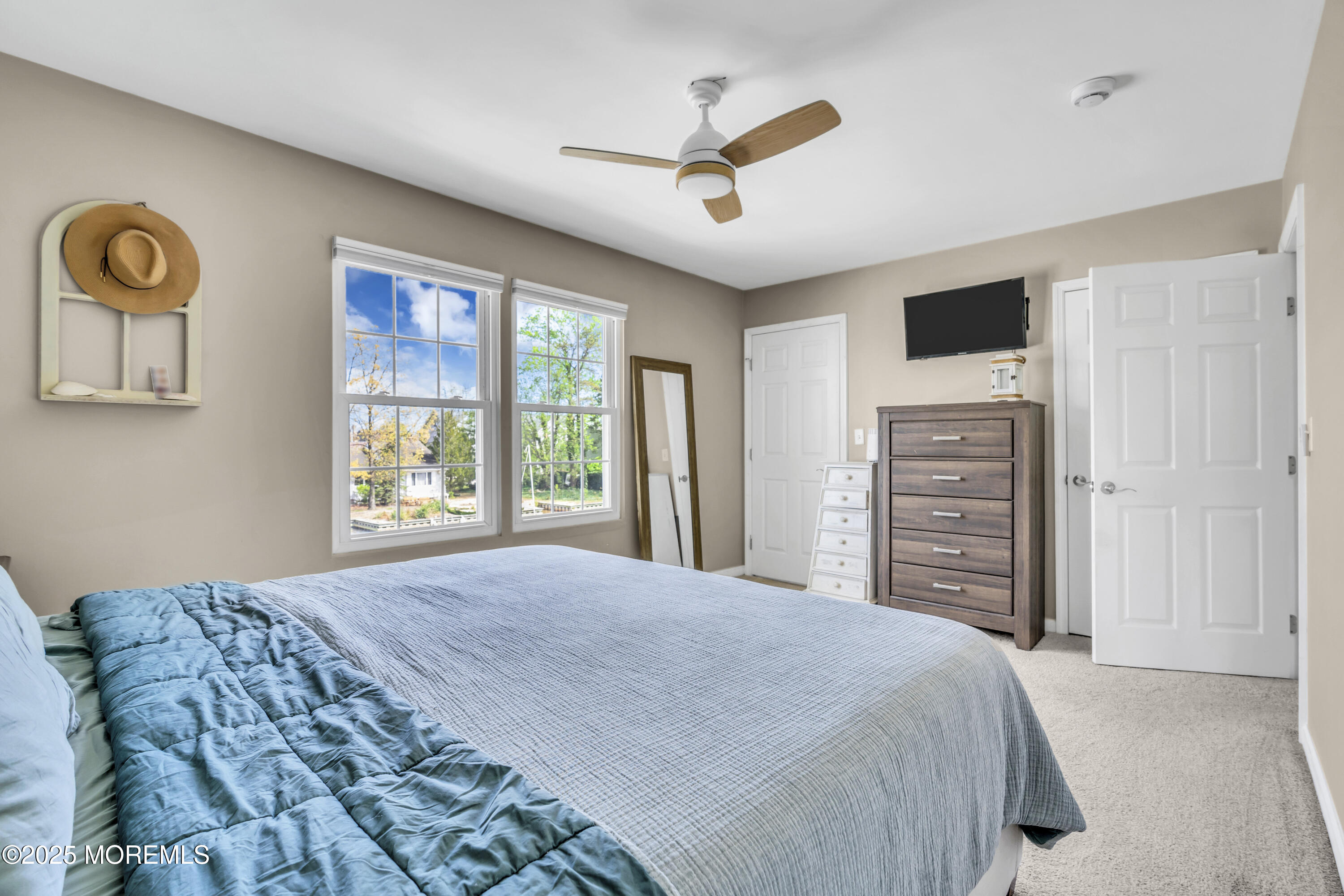 650 Drum Point Road Brick, NJ 08723 - Photo 36 of 42 a bedroom with a bed a dresser and a window
