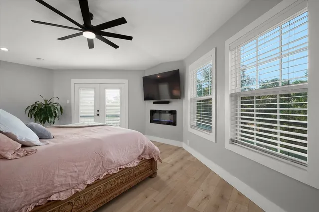 a bedroom with a bed and a lamp