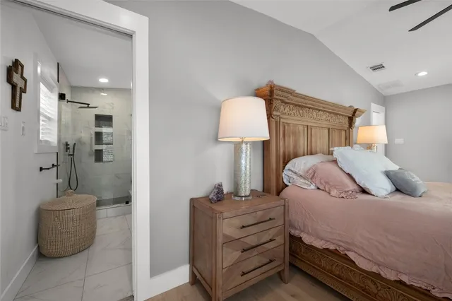 a spacious bathroom with a double vanity sink mirror and bathtub