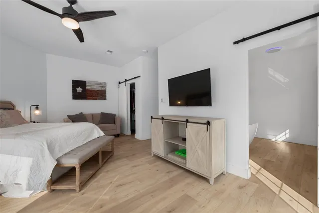 a bathroom with a white bath tub and shower