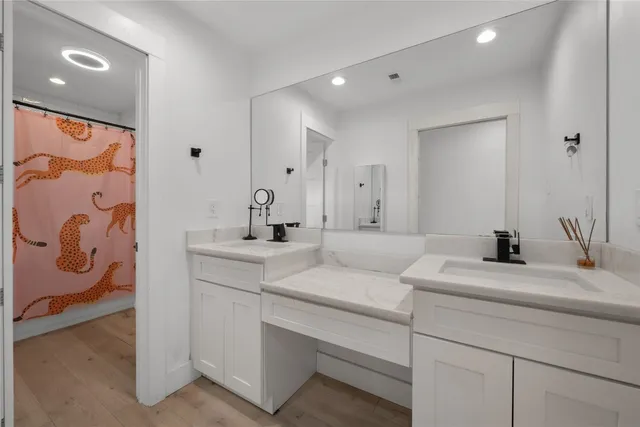 a view of balcony with chairs and wooden floor