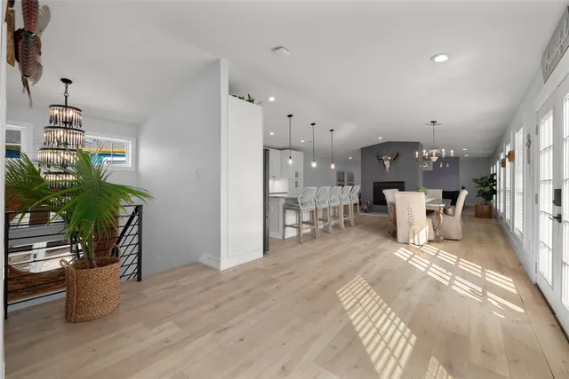 a dining room with furniture and wooden floor