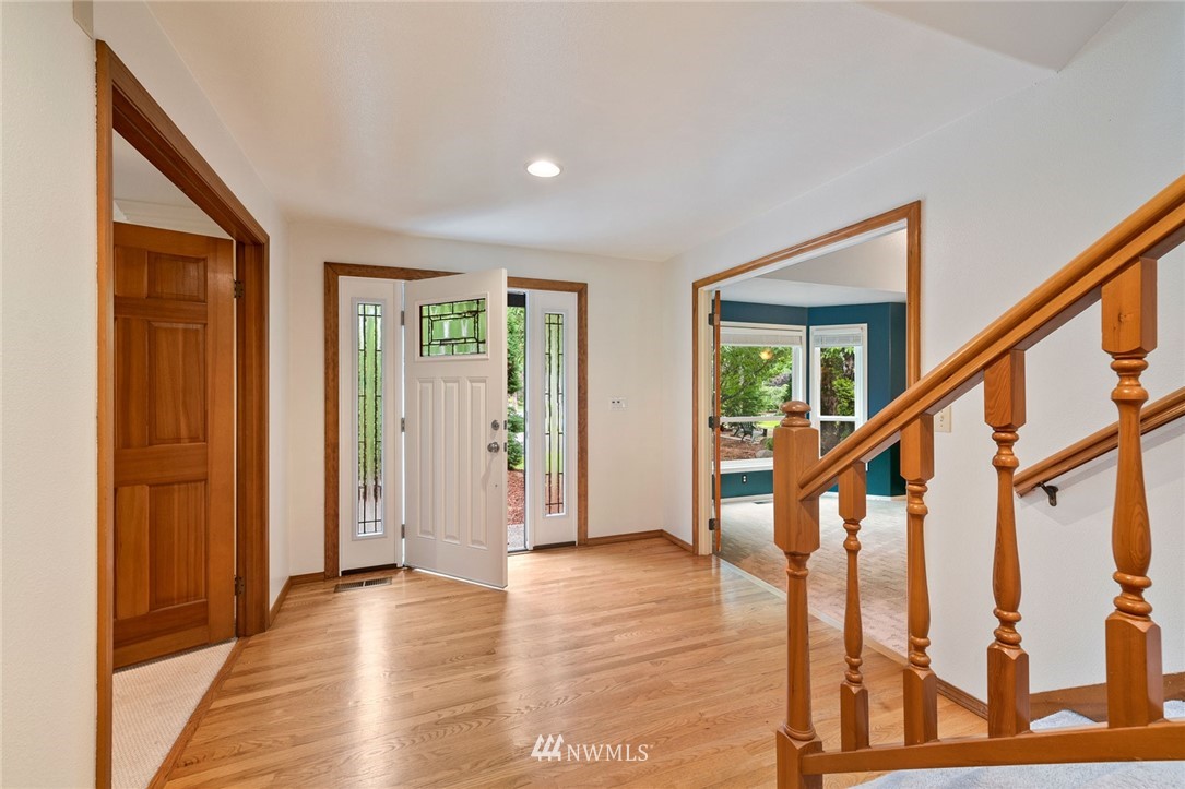 16045 Southeast 149th Street Renton, WA 98059 - Photo 2 of 39 a view of an entryway with wooden floor and door