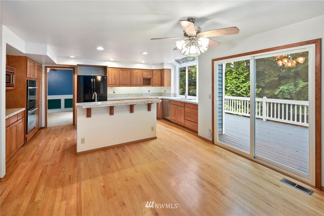 16045 Southeast 149th Street Renton, WA 98059 - Photo 11 of 39 a view of kitchen with furniture and large window