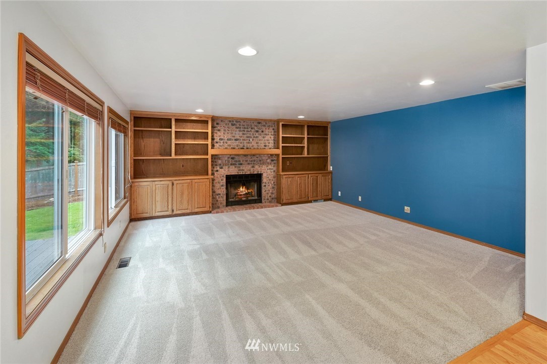 16045 Southeast 149th Street Renton, WA 98059 - Photo 18 of 39 a view of empty room with a fireplace