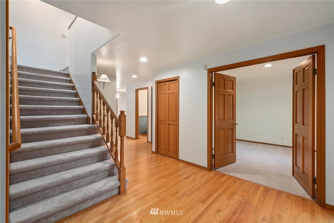 16045 Southeast 149th Street Renton, WA 98059 - Photo 3 of 39 a view of entryway with wooden floor and stairs