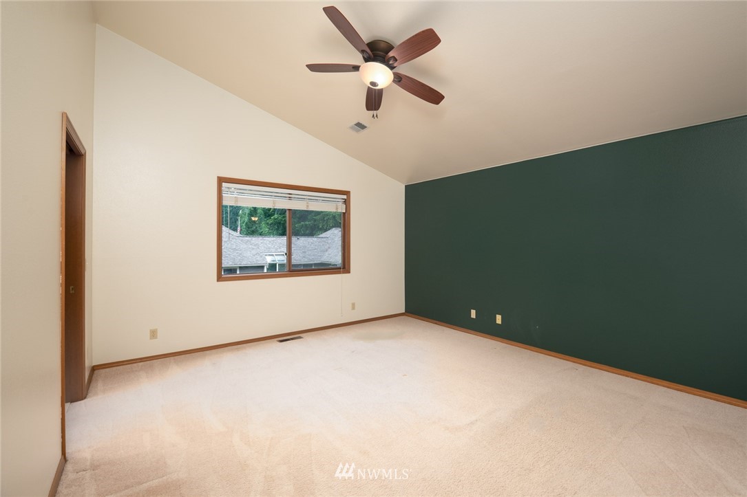 16045 Southeast 149th Street Renton, WA 98059 - Photo 24 of 39 an empty room with a window and a ceiling fan