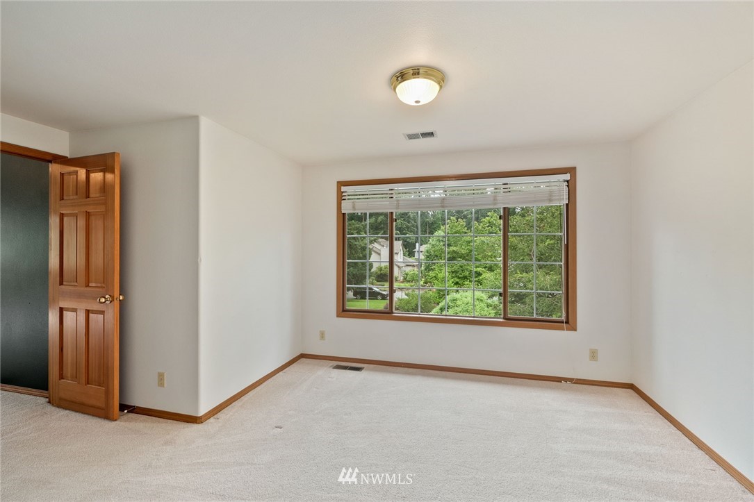 16045 Southeast 149th Street Renton, WA 98059 - Photo 31 of 39 an empty room with windows and closet
