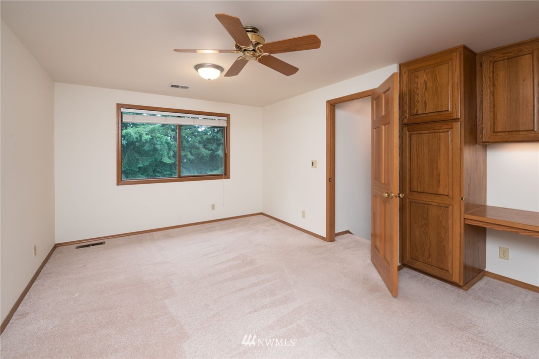 16045 Southeast 149th Street Renton, WA 98059 - Photo 32 of 39 an empty room with windows and closet