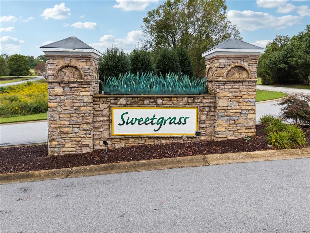 1132 Sydney Lane Demorest, GA 30535 - Photo 6 of 6 a front view of a house with a yard and garage