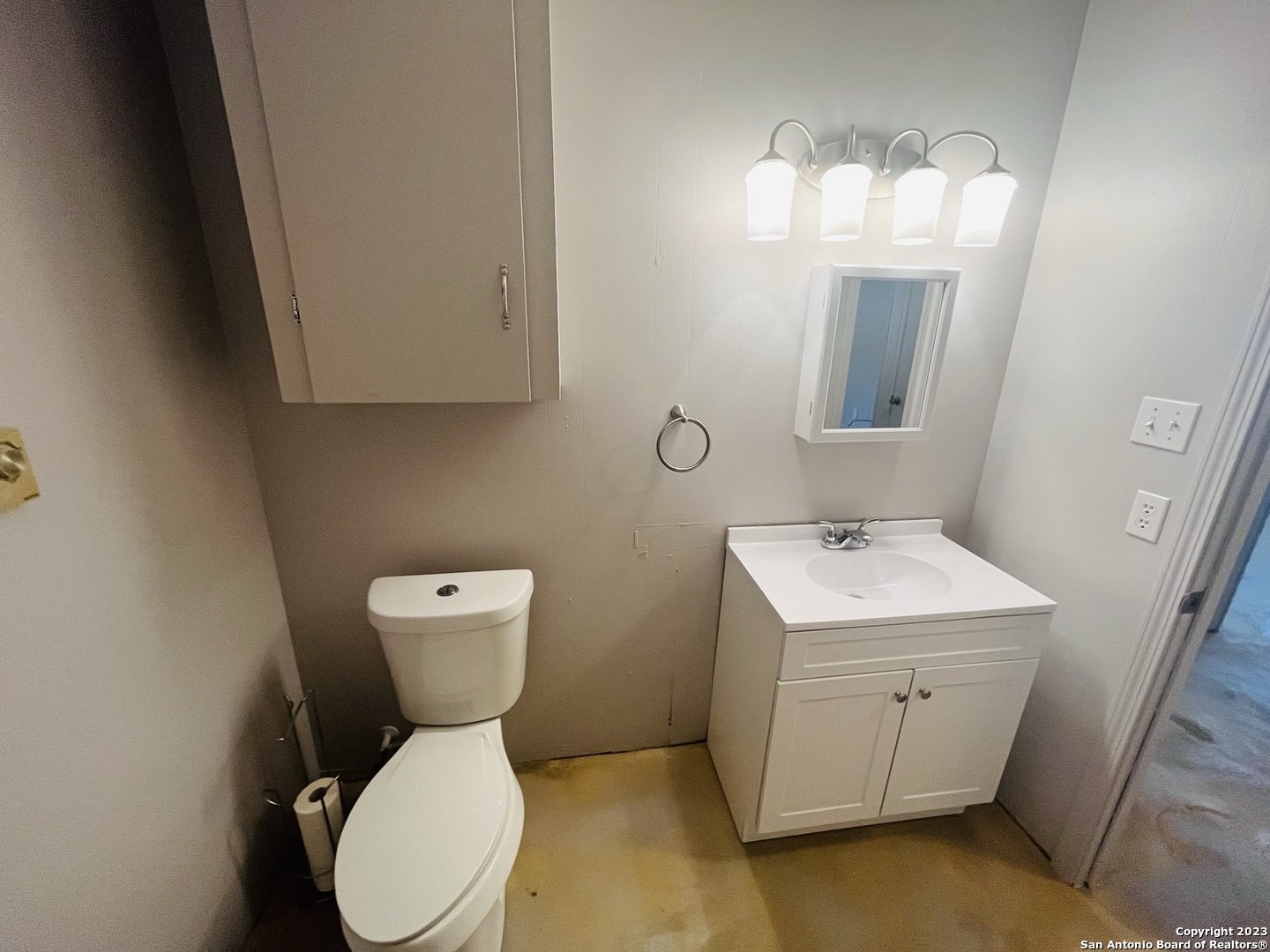 222 Redbud Lane, Unit A New Braunfels, TX 78130 - Photo 12 of 16 a bathroom with a toilet sink and mirror