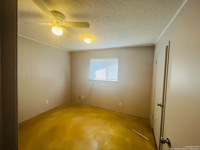 an empty room with a bathroom