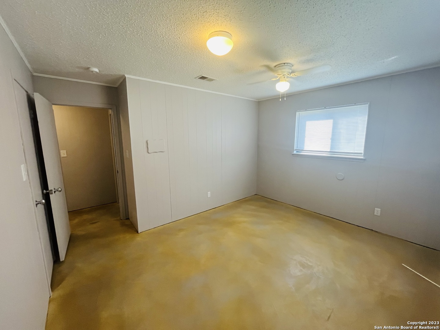 222 Redbud Lane, Unit A New Braunfels, TX 78130 - Photo 15 of 16 an empty room with closet and a chandelier fan