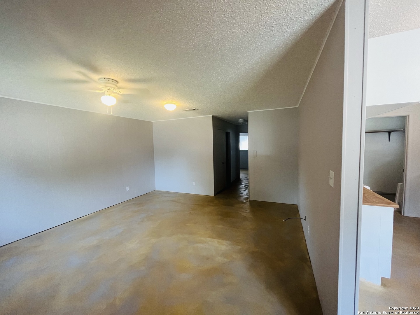 222 Redbud Lane, Unit A New Braunfels, TX 78130 - Photo 5 of 16 a view of an empty room and a gallery