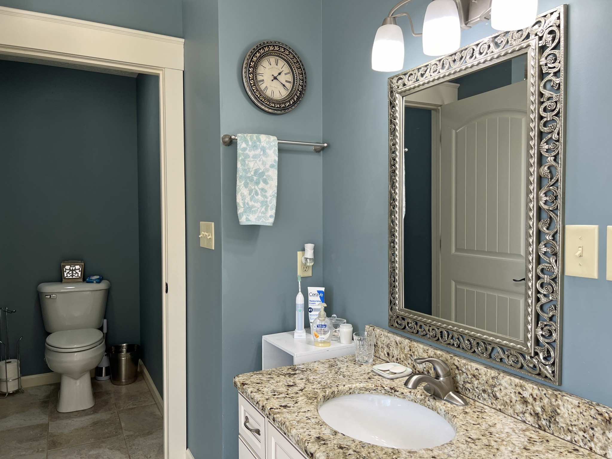 425 Alvaton- Greenhill Road Bowling Green, KY 42103 - Photo 19 of 68 a bathroom with a granite countertop toilet a sink and a mirror