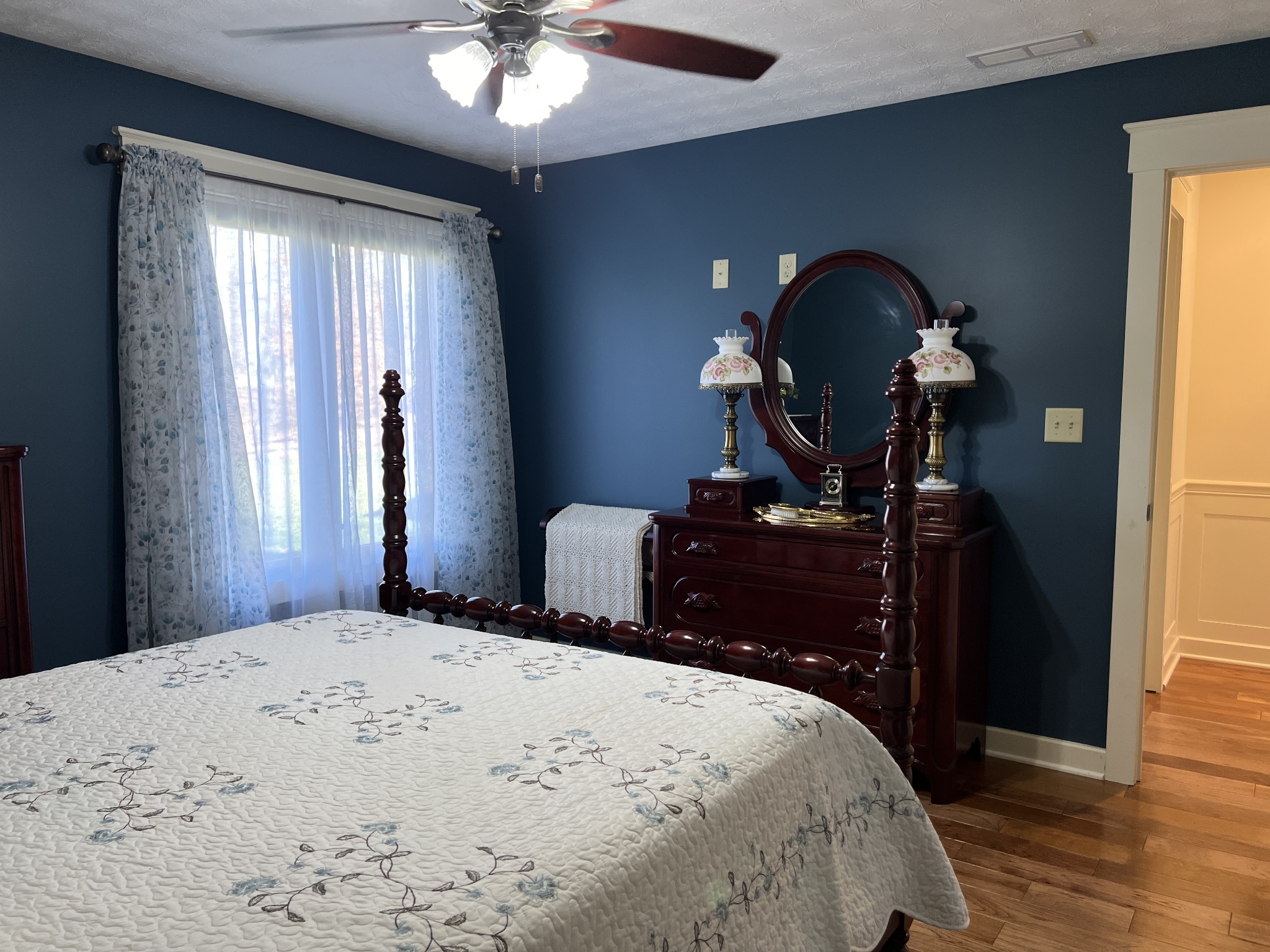425 Alvaton- Greenhill Road Bowling Green, KY 42103 - Photo 22 of 68 a bedroom with a bed and a chandelier