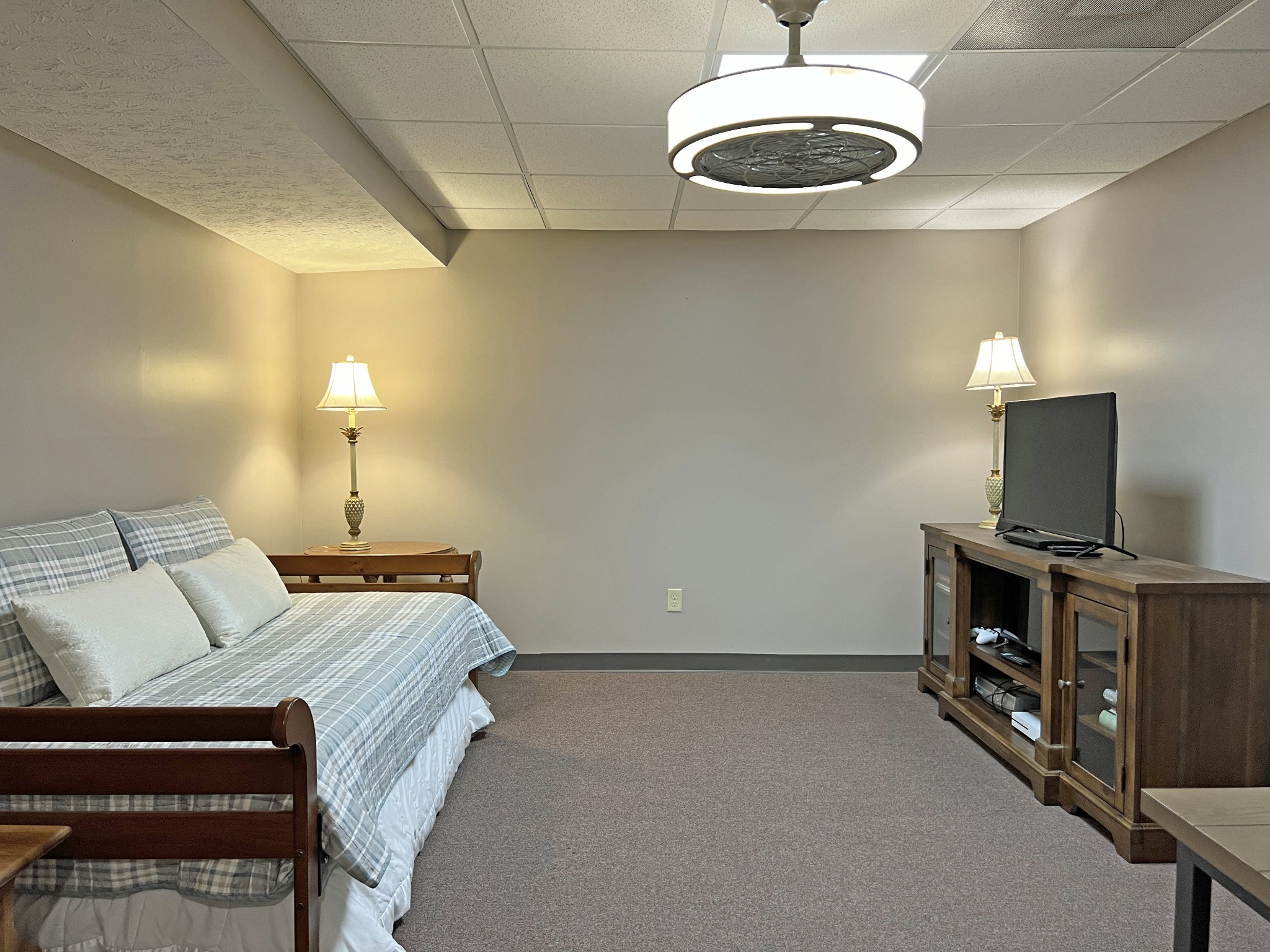 425 Alvaton- Greenhill Road Bowling Green, KY 42103 - Photo 32 of 68 a spacious bedroom with a bed and a flat screen tv