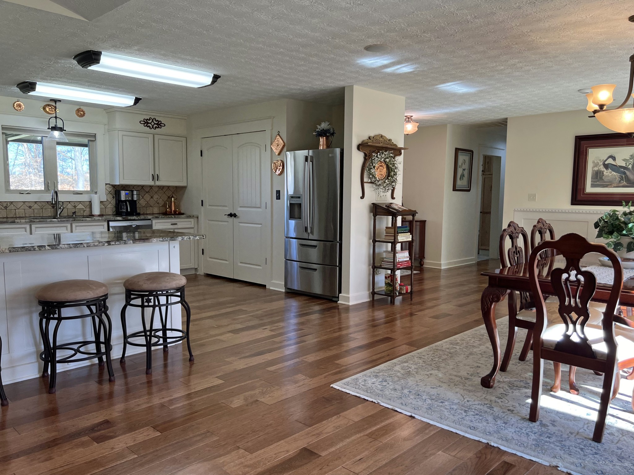425 Alvaton- Greenhill Road Bowling Green, KY 42103 - Photo 6 of 68 a kitchen with stainless steel appliances granite countertop a table chairs refrigerator and a stove