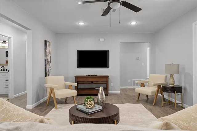 a living room with furniture and a flat screen tv