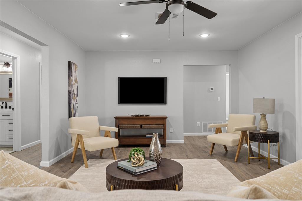 2602 Taylor Street Commerce, TX 75428 - Photo 3 of 37 a living room with furniture and a flat screen tv