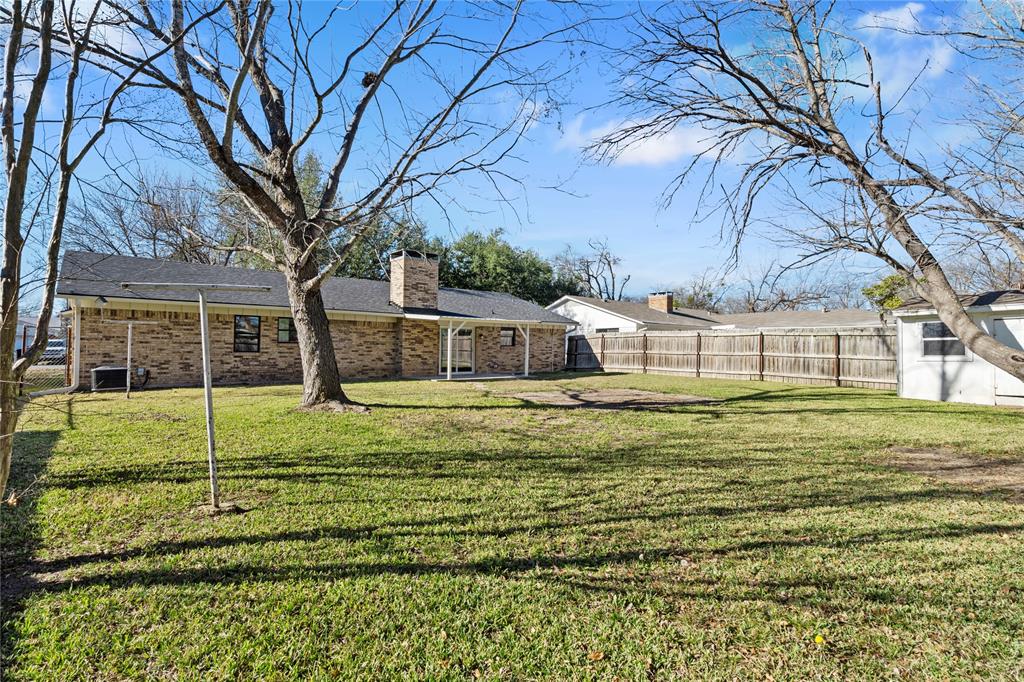 2602 Taylor Street Commerce, TX 75428 - Photo 31 of 37 a view of a house with a backyard