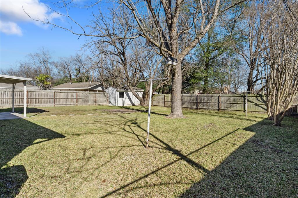 2602 Taylor Street Commerce, TX 75428 - Photo 34 of 37 a view of a yard with basketball court