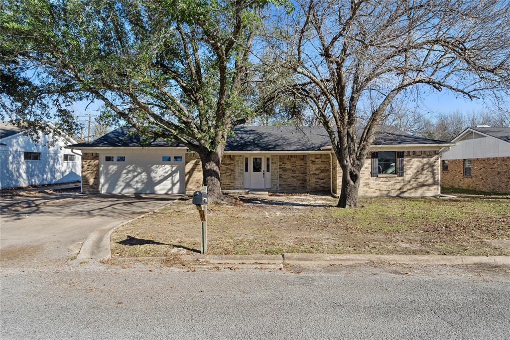 2602 Taylor Street Commerce, TX 75428 - Photo 36 of 37 a view of a house with snow on the road
