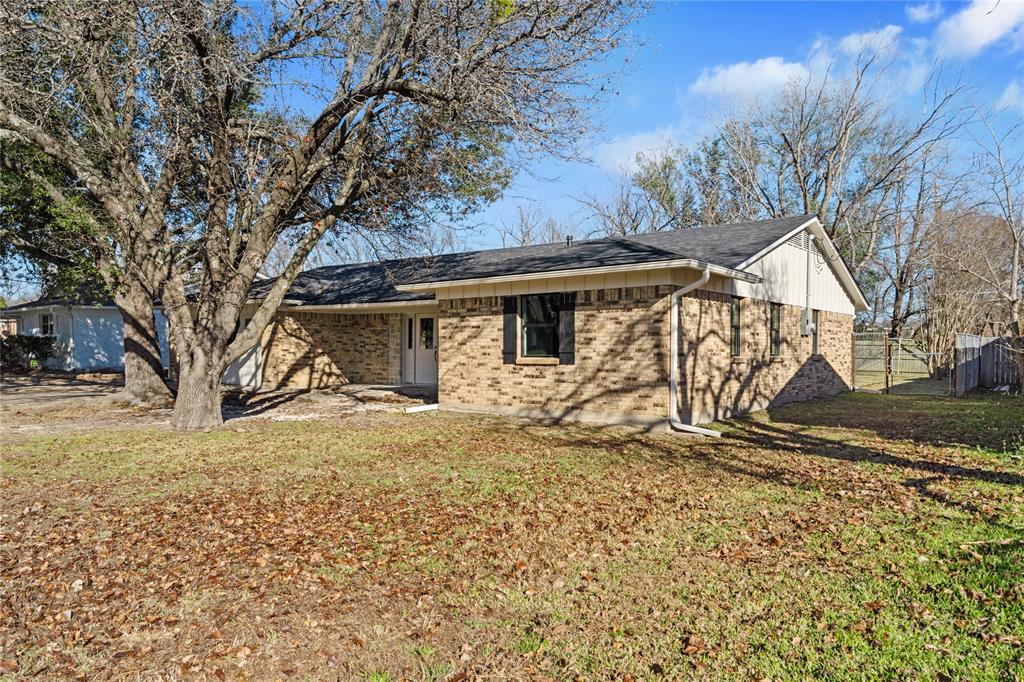 2602 Taylor Street Commerce, TX 75428 - Photo 37 of 37 a view of a house with a yard covered with snow