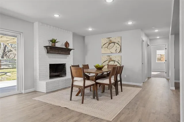 a view of a livingroom with furniture and a fireplace