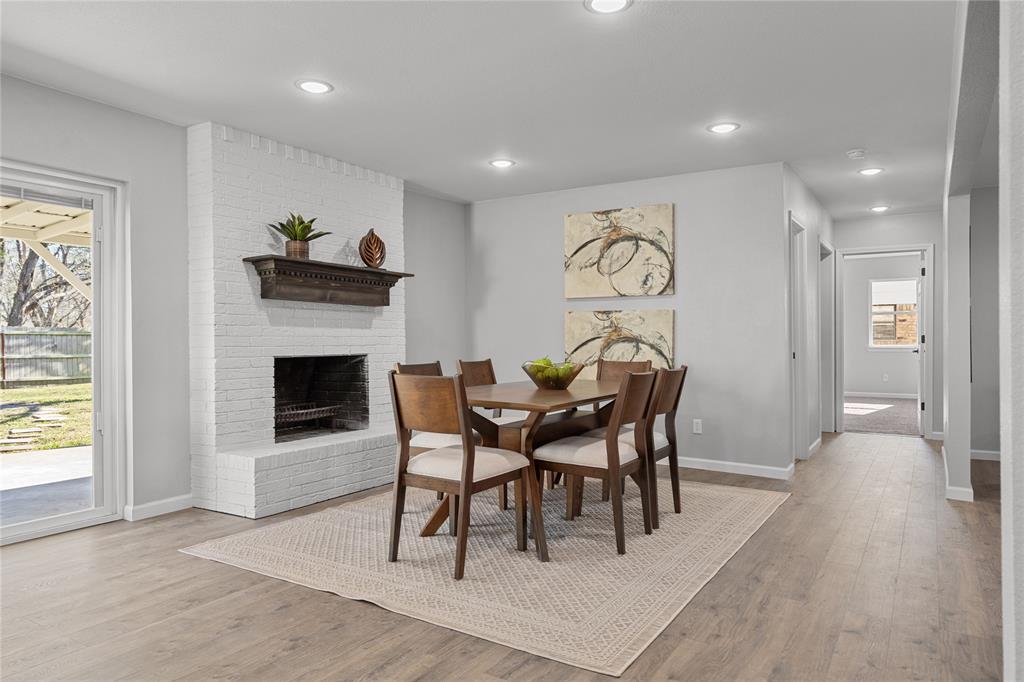2602 Taylor Street Commerce, TX 75428 - Photo 9 of 37 a view of a livingroom with furniture and a fireplace