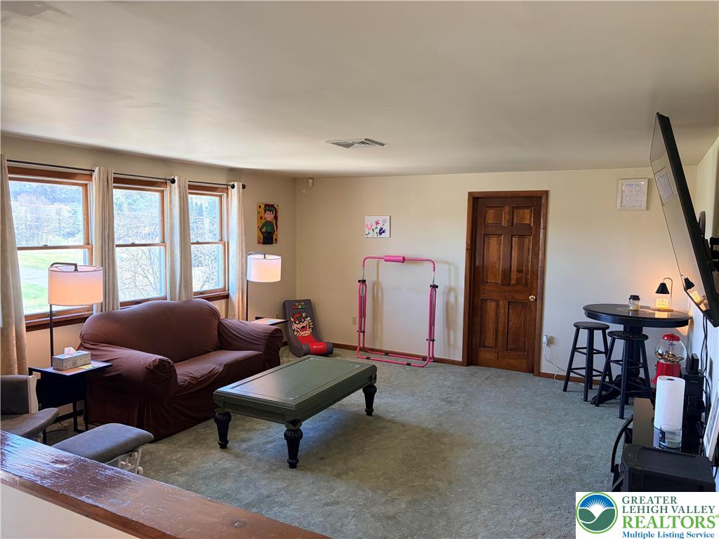 100 Hazelwood Road Lehighton, PA 18235 - Photo 30 of 31 a living room with furniture and a window
