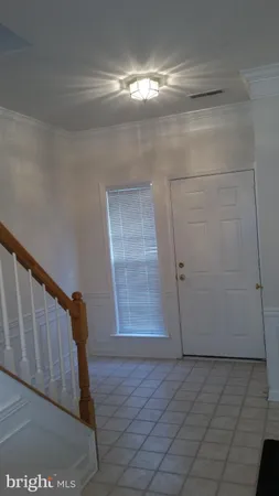 a view of empty room with windows