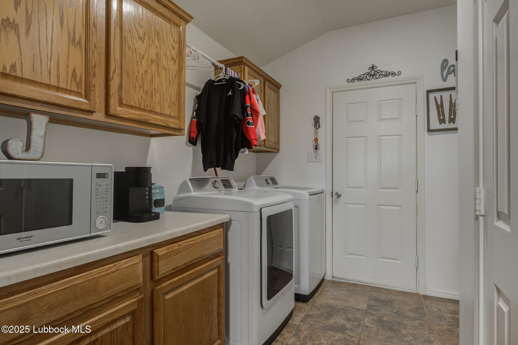 6223 18th Street Lubbock, TX 79416 - Photo 14 of 29 a kitchen with a sink and cabinets