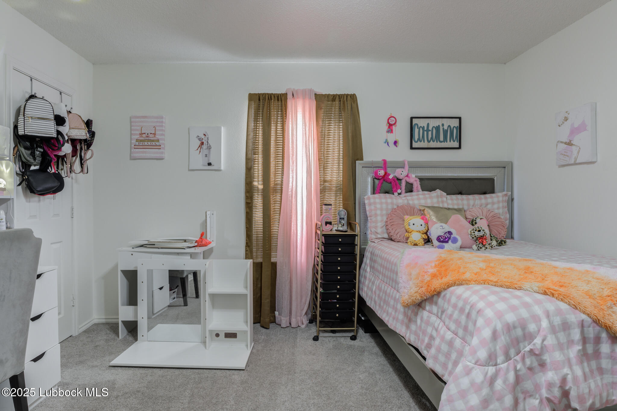 6223 18th Street Lubbock, TX 79416 - Photo 22 of 29 a bedroom with a bed and a refrigerator