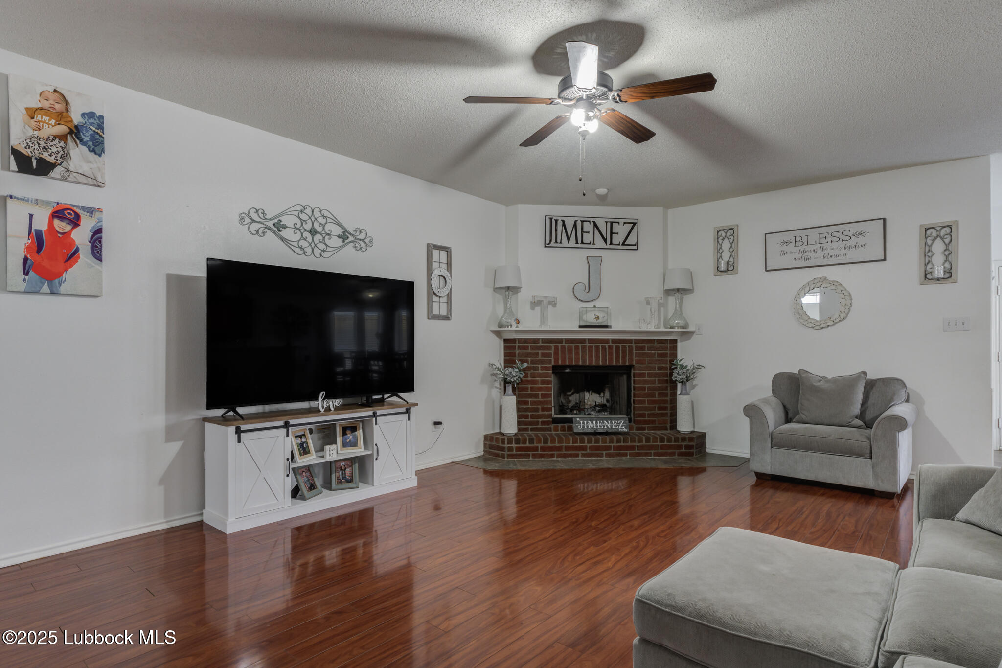 6223 18th Street Lubbock, TX 79416 - Photo 5 of 29 a living room with furniture and a flat screen tv
