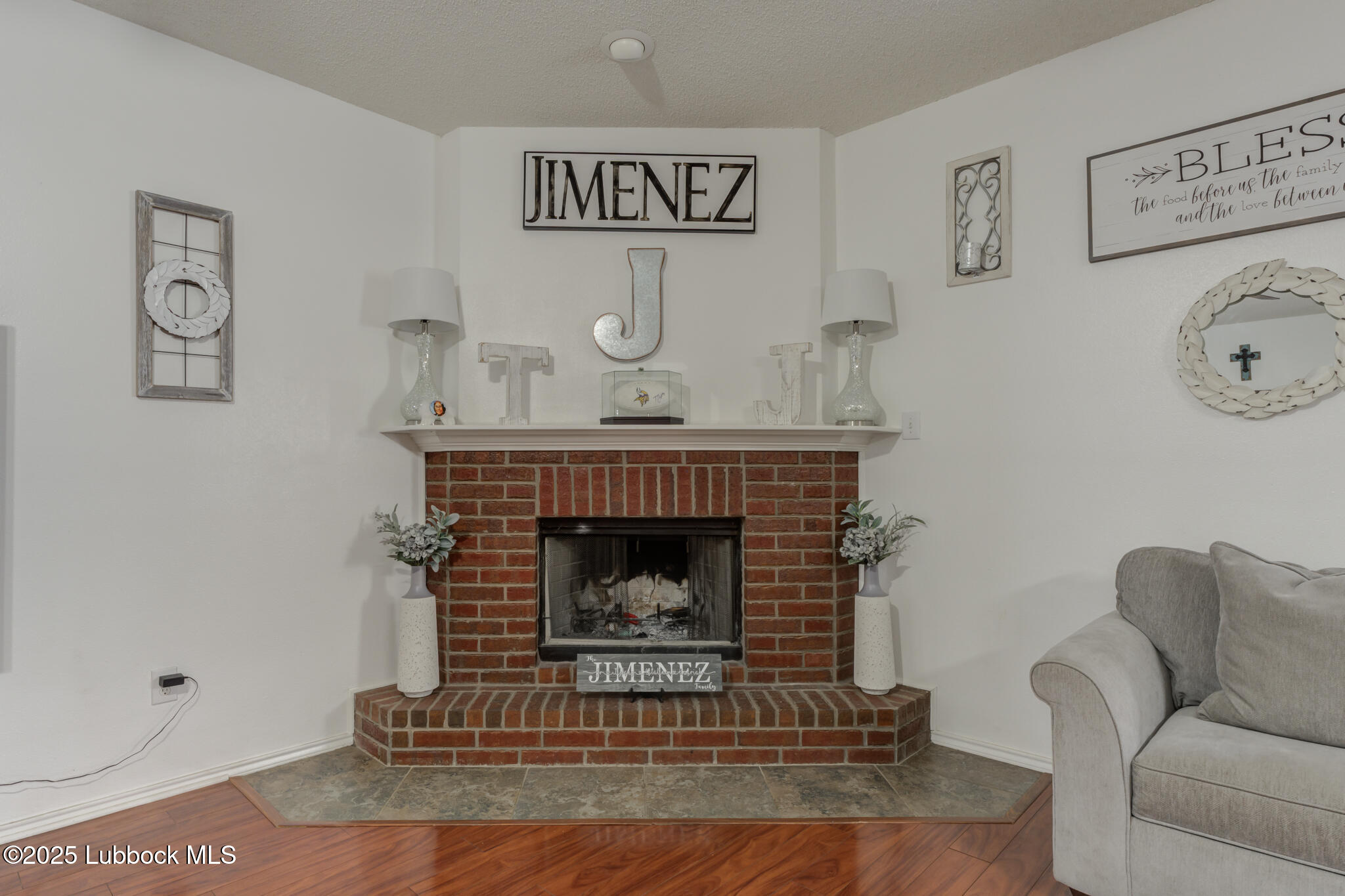 6223 18th Street Lubbock, TX 79416 - Photo 6 of 29 a living room with furniture and a fireplace