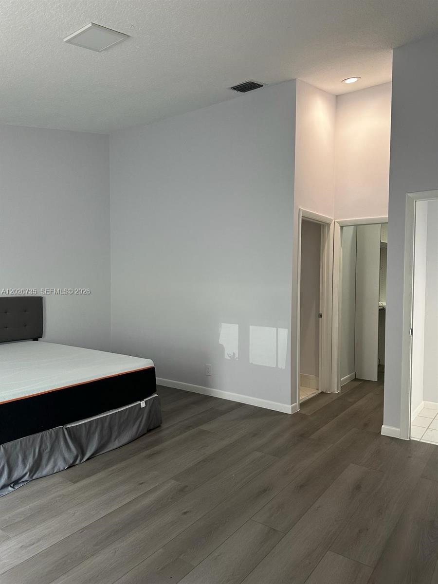 17244 Balboa Point Way Boca Raton, FL 33487 - Photo 15 of 66 a room with a bed and a table