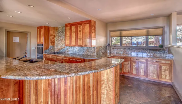 a kitchen with large windows