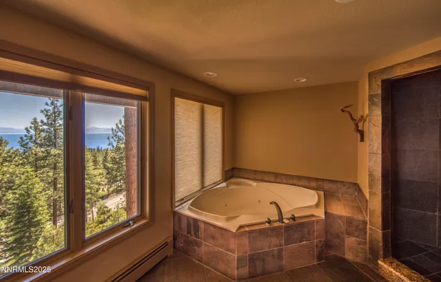 a kitchen with a sink and large windows